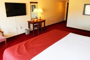 a hotel room with a bed and a desk at Hoover Dam Lodge in Boulder City