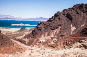 a dirt road in the middle of a mountain next to the ocean at Hoover Dam Lodge in Boulder City