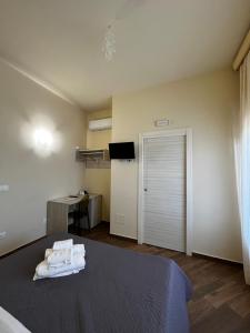 Postel nebo postele na pokoji v ubytování All’Anoneto B&B