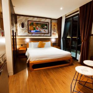 Un ou plusieurs lits dans un hébergement de l'établissement Beach apartment apec Phú Yên