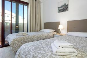 Ein Bett oder Betten in einem Zimmer der Unterkunft Apartamento Pedro