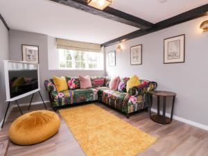 Posezení v ubytování Battel Hall Cottage