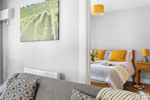 a living room with a couch and a table at Old Walls Vineyard in Bishopsteignton