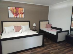 Postel nebo postele na pokoji v ubytování Hotel Corona