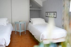 Postel nebo postele na pokoji v ubytování Hôtel Picardia