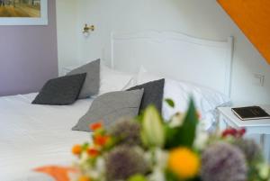 Postel nebo postele na pokoji v ubytování Hôtel Picardia