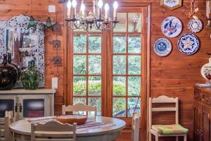 a dining room with a table and a window at Villa Achada da Mouca by Homie in Santana