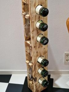 a wine rack made out of wine bottles at Ferienwohnung Nr.3 in Traben-Trarbach