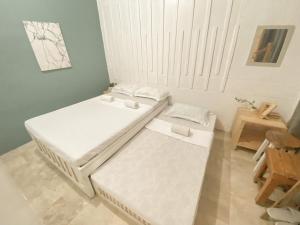 Cama o camas de una habitación en Pallet Homes - Tabuc Suba