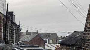 an overhead view of roofs of houses and buildings at ☆ The Cottage - Cosy 1 bedroom, central location ☆ in Harrogate
