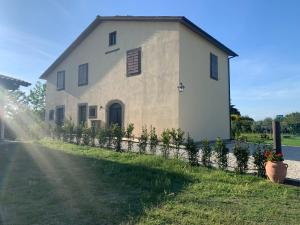 a large white building with a fence in front of it at L'Acero di STALL in Viterbo