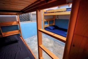 a small room with two bunk beds in it at Odyssey Divers Hostel in Xiaoliuqiu