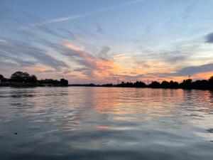 a sunset over a large body of water at Casa Nicola in Mila Douăzeci şi Trei