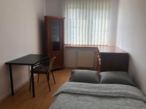 Postel nebo postele na pokoji v ubytování Blue River - Daszynskiego