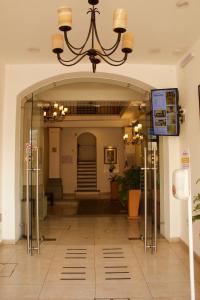 an entrance to a building with a chandelier at Hotel Real Alma in Oaxaca City