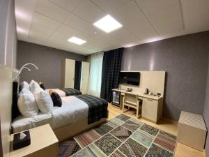 TV a/nebo společenská místnost v ubytování Badam d'Art Boutique Hotel
