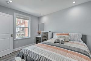 a bedroom with a bed and a window at DC Guesthouse with Fire Pit 6 Mi to Ivy City! in Washington, D.C.