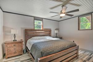 a bedroom with a bed and a ceiling fan at Modern Central Apartment with BBQ Patio and Yard! in Central