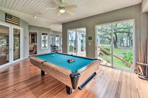 a pool table in the middle of a room at Serene Waterfront Retreat On Okatie River! in Bluffton