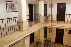 an image of a hallway with stairs in a building at Hotel Real Alma in Oaxaca City