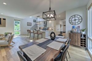 a dining room and kitchen with a table and chairs at Contemporary Raleigh Home about 2 Mi to Downtown! in Raleigh