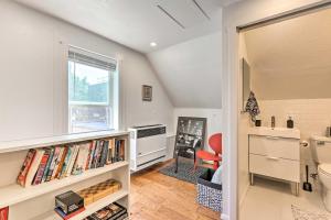 a room with a window and a book shelf with books at Chic, Treetop Denver Apt about 2 Mi to Downtown! in Denver