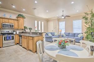 a kitchen and living room with a table and chairs at South Padre Island Condo - 200 Ft to Beach! in South Padre Island