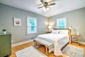 a bedroom with a bed and a ceiling fan at Idyllic Springfield Haven with Screened Porch! in Springfield
