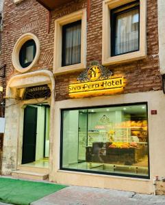 a store front of a pizza house with a sign at Şiva Pera Hotel & SPA in Istanbul