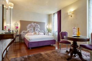 Posteľ alebo postele v izbe v ubytovaní Residenza Elisabetta Luxury