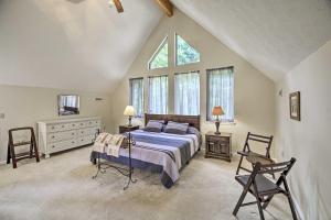 a bedroom with a bed and a large window at Secluded Mountain City Home with Deck and Views! in Mountain City
