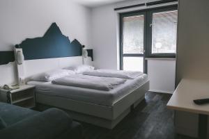 Łóżko lub łóżka w pokoju w obiekcie Apartments Margarethenbad