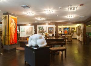 Uma área de estar em Studio Hotel Boutique