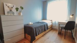 Posteľ alebo postele v izbe v ubytovaní Apartament Honoratka