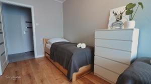 Posteľ alebo postele v izbe v ubytovaní Apartament Honoratka