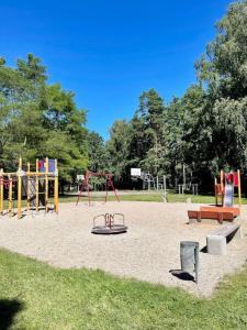 a park with a playground with a play equipment at panoramic view and free parking in Vilnius