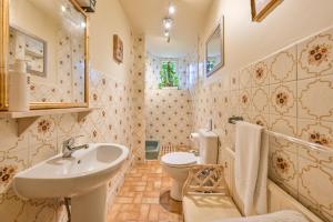 a bathroom with a sink and a toilet at The Town House at Muntham- Luxury Holiday Home with Hot Tub in Torquay