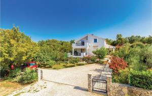 an image of a house with a driveway at Cozy Apartment In Brzac With Wifi in Brzac