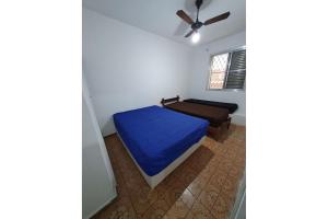 A bed or beds in a room at Apartamentos Enseada Guaruja - Hawai
