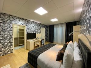 Postel nebo postele na pokoji v ubytování Badam d'Art Boutique Hotel