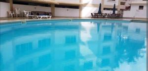 The swimming pool at or close to BEACHFRONT OCEAN VIEW ROOMS WITH A SWIMMING POOL