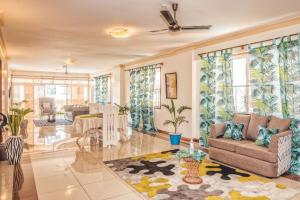 A seating area at BEACHFRONT OCEAN VIEW ROOMS WITH A SWIMMING POOL
