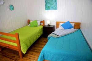 سرير أو أسرّة في غرفة في Si Po Hostel