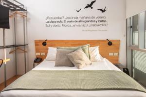 Postel nebo postele na pokoji v ubytování Verso Hotel