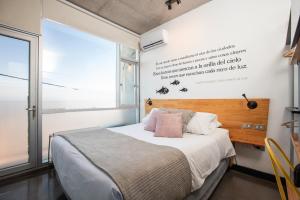 Postel nebo postele na pokoji v ubytování Verso Hotel
