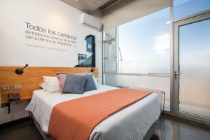Postel nebo postele na pokoji v ubytování Verso Hotel