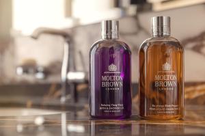 two bottles of alcohol sitting on top of a counter at Allure Hotel Prague in Prague