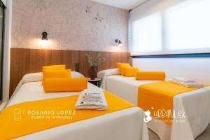 A bed or beds in a room at Urbanlux Olimpia Sleep & Park