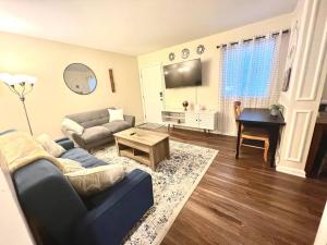 a living room with a couch and a table at *Prime Pad * King Bed * Long Term Stays* in Durham