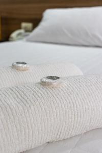 Letto o letti in una camera di Das Heim Hotel